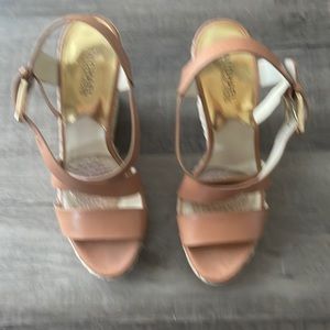 Michael Kors Wedge sandal in a tan colour in a size 10